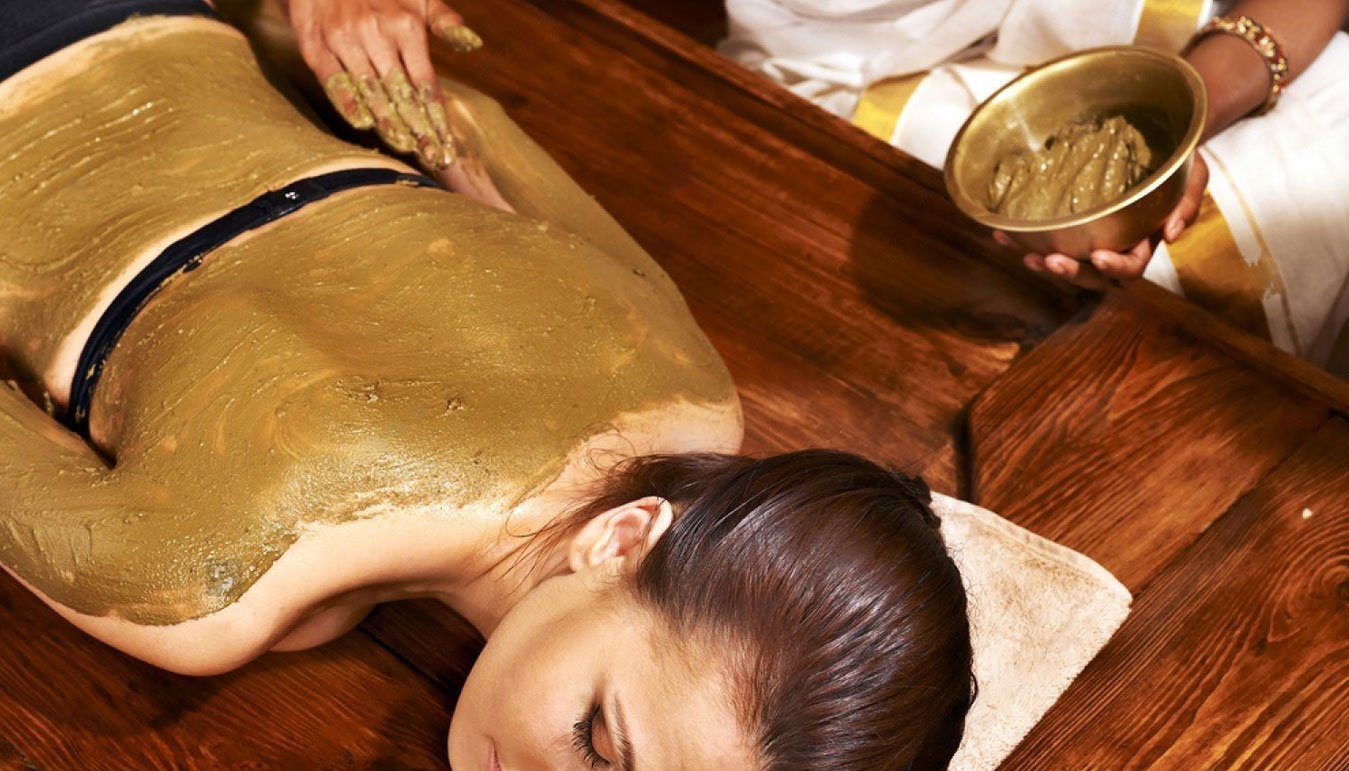 Girl taking Clay therapy for Vata Dosha